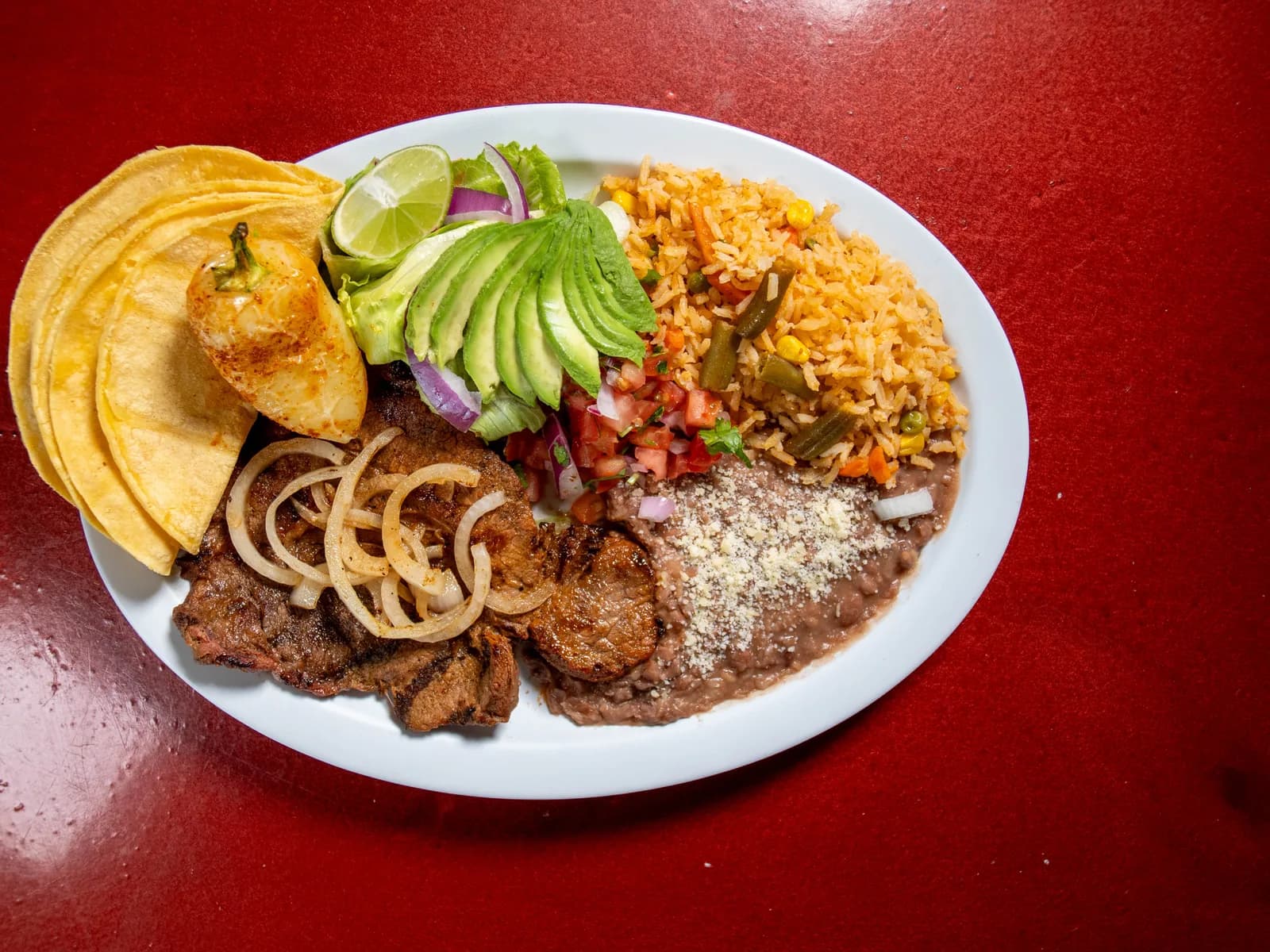 Carne Asada Plate with rice, beans, tortillas and avocado